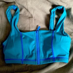 Buff bunny dive bra in color teal with blue stitching